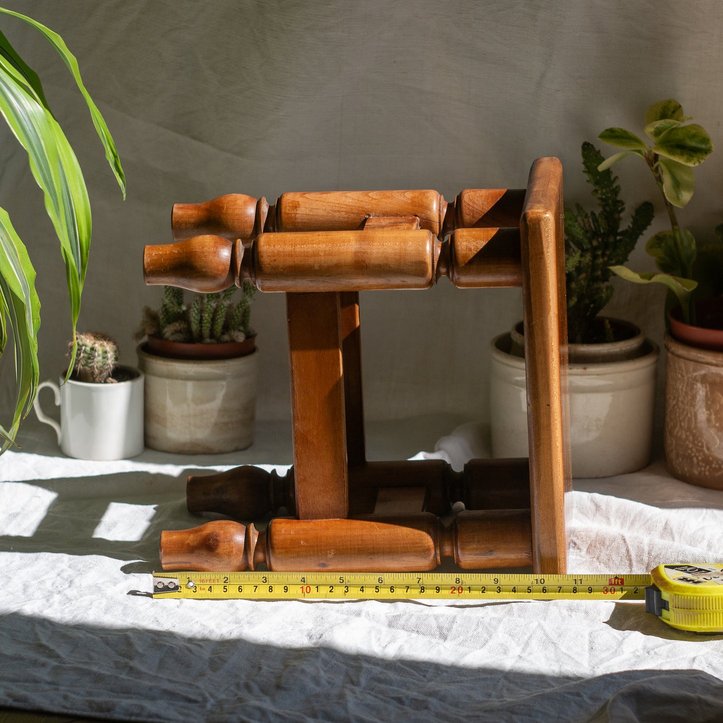 A handsome vintage French wooden stool in a lovely shade of honey-coloured brown. This old stool is very solid and would make a great plant stand (we currently use one on our desk as a plant stand and it looks great!) and many other decorative possibilities.