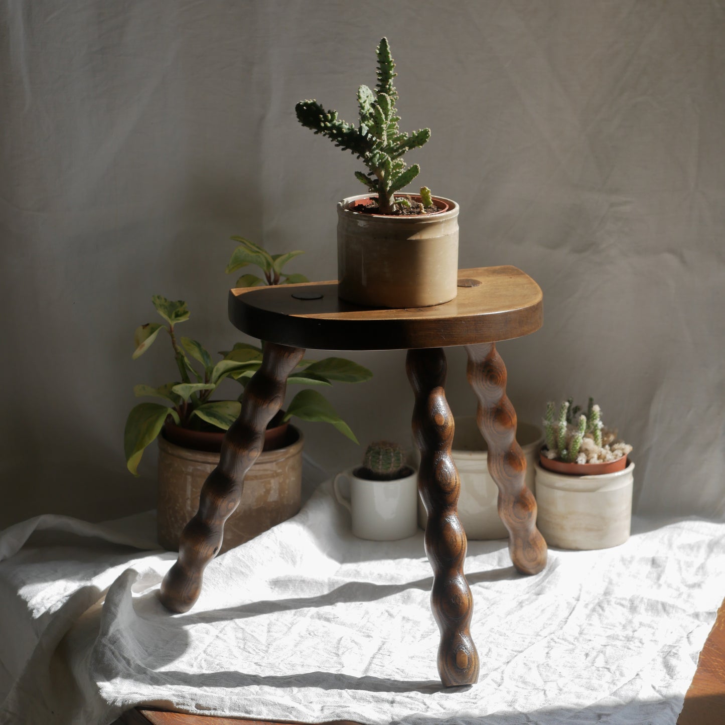 French vintage wooden stool with three turned wooden legs