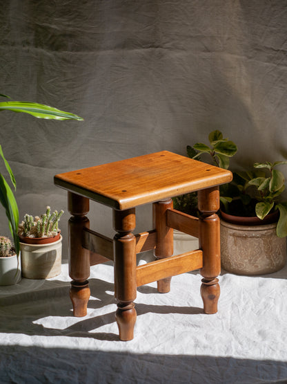 A handsome vintage French wooden stool in a lovely shade of honey-coloured brown. This old stool is very solid and would make a great plant stand (we currently use one on our desk as a plant stand and it looks great!) and many other decorative possibilities.