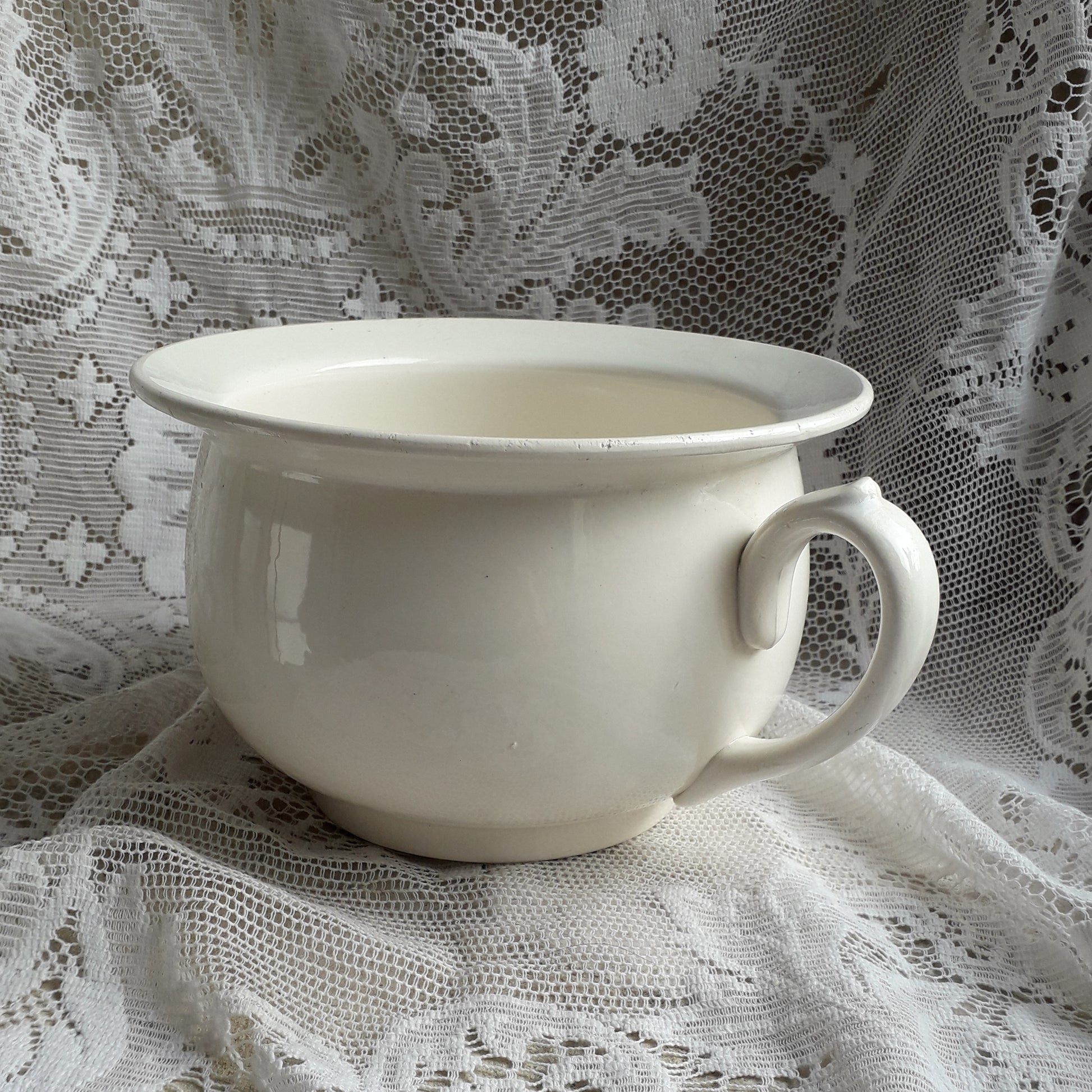 A nice little vintage ironstone white/cream chamber pot by premier French manufacturer, Sarreguemines, the perfect addition for a country home, bathroom decor, or even as a planter. Circa. 1920 - 1950.